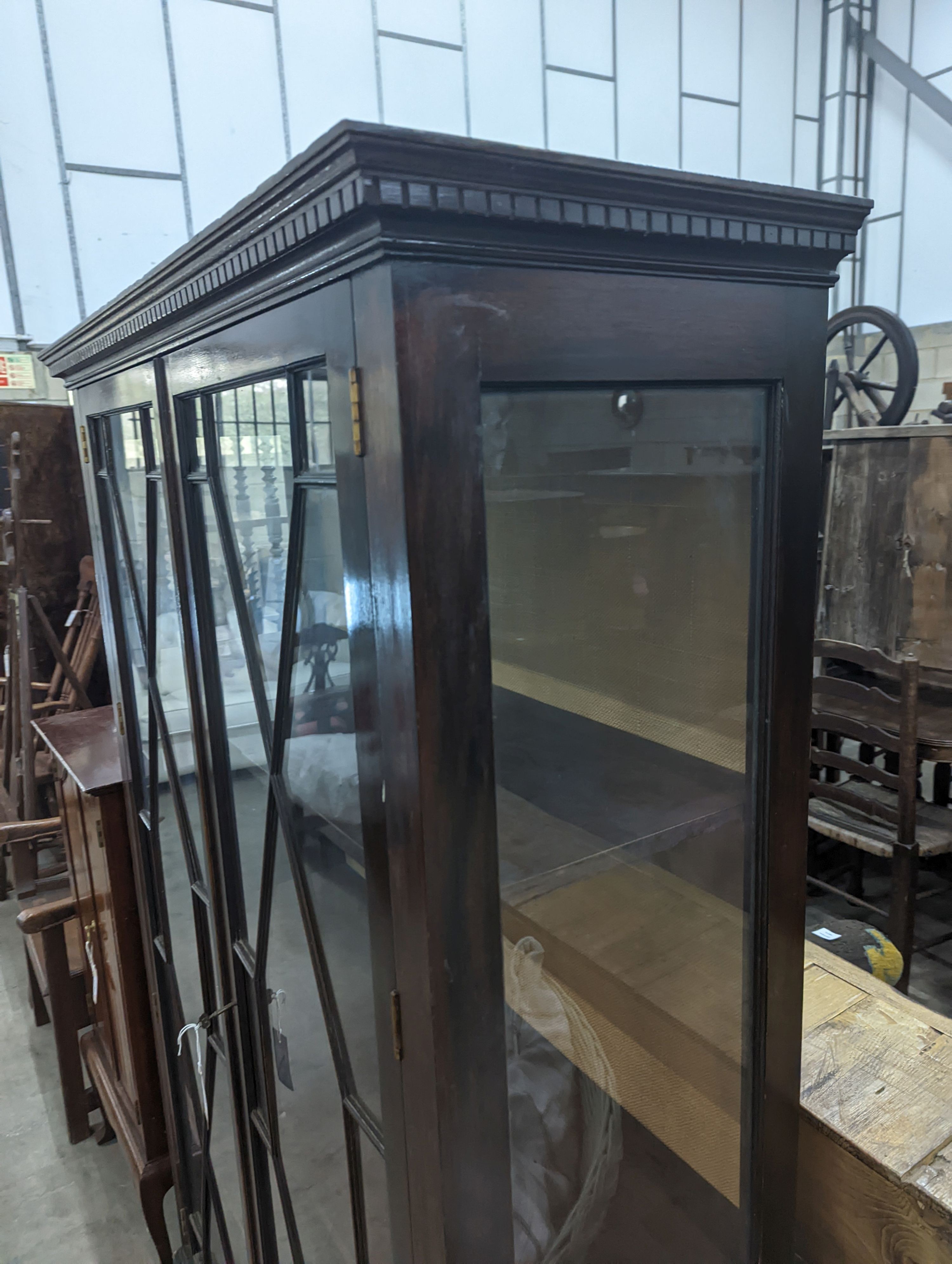 A reproduction George III style glazed mahogany two door display cabinet, width 108cm, depth 40cm, height 172cm